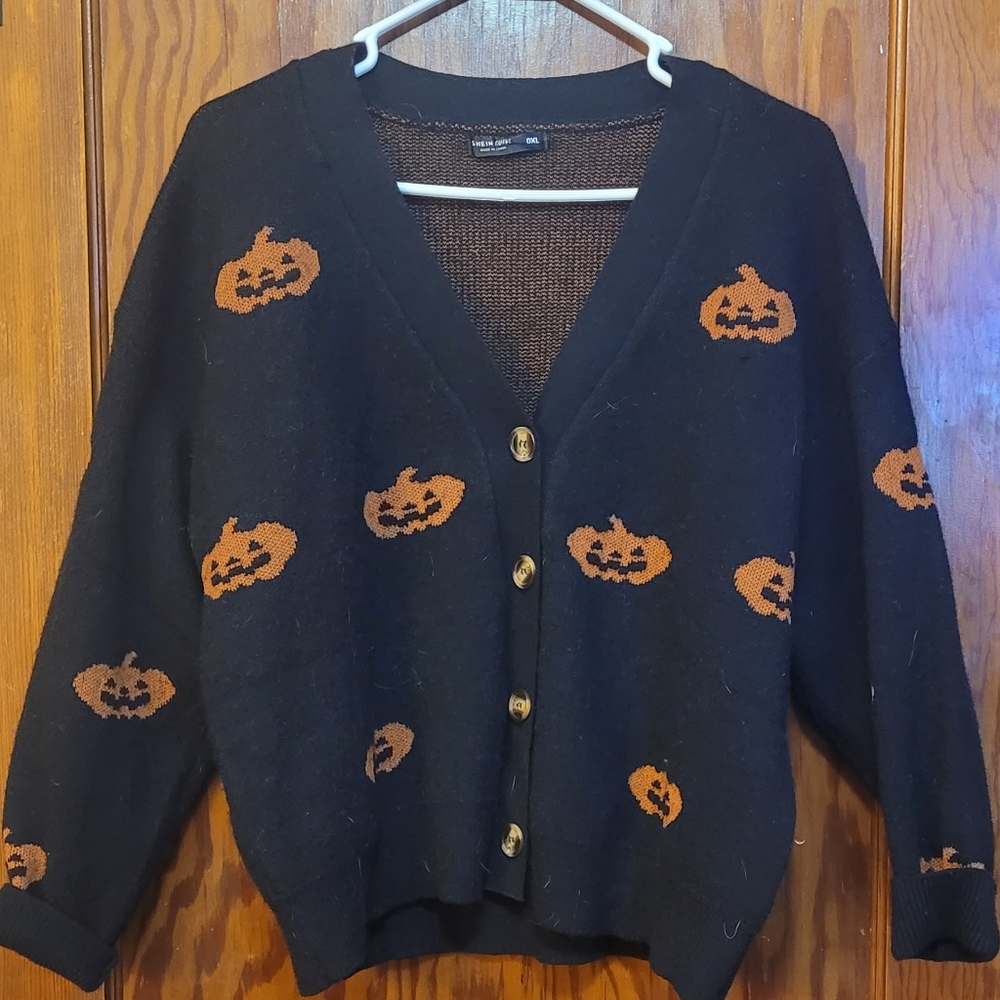 Black button-up cardigan with pumpkin designs